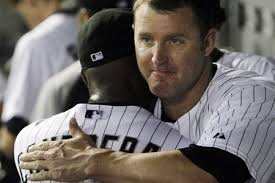 Jim Thome hugs someone else