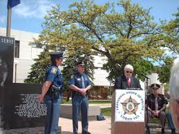 View full sizePhoto courtesy Nora Paquette | Trooper Wendy Burnis, 1st Lt. John Card and Crimestoppers\u0026#39; Tom Matuszewski during the May 16 ceremony. - burniscardjpg-1f14fe6b3f117c5d