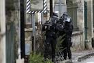 Police detain 9 in manhunt for Charlie Hebdo attack suspects.