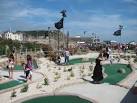 The park includes fairground rides, crazy golf, trampolines, a boating pool, - via Daymix