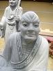 Stone Rakan statues outside