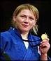 Michelle Rogers' win in the under 78kg category ensures a gold medal treble ... - _38172242_rogers_pa101