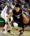 Harvard's Jeremy Lin drives by
