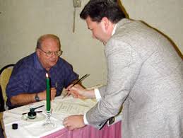 Mike Marttila (seated), Construction and Contract Administration director, and Jon Husby, District 7 transportation district engineer, participate in the ... - 28-sla-mikem&jonh