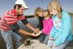 Happy family outdoor observes - via Daymix