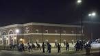 Two police officers shot outside Ferguson police department.
