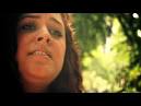 Erin Willett performs her original song "Home" at a piano set up in City