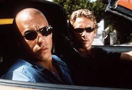 Vin Diesel (trái) và Paul trong &quot;Fast and Furious&quot;. Ảnh: AP. - fast-furious-3727-1385980018