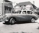 Photo of a 2 tone Sunbeam Talbot 90 Mk3 car, and another being ...