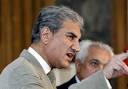 Mehmood Qureshi, left,