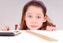 Girl working on math homework. Image by Cheryl Casey/Shutterstock.com. - shutterstock_8894620