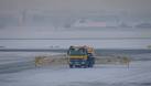 A truck sprays de-icing fluid onto the apron. I don't know what the fluid - via Daymix