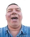 Fat man in his 50's laughing.