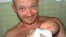 Daniel Holmes with his baby
