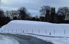 Landform is a land sculpture by Charles Jencks which dominates the grounds - via Daymix
