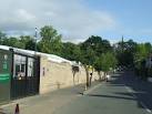 Behind the wall to the left are the grounds of Wimbledon tennis club. - via Daymix