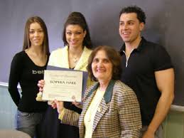 Sophia Hall (2nd from left) receives award from. Dr. Marie Lise Gazarian, as student moderators. Yvonne Cassimatis (left) and Spiros Kostaras - sophiahall1