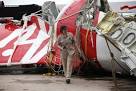 Divers retrieve black box data recorder from AirAsia wreck.