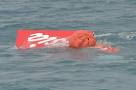 AirAsia Flight QZ8501: Tail of crashed plane lifted out of Java.