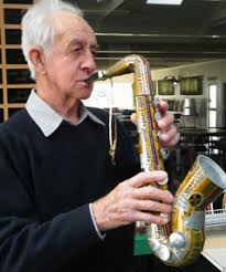 Peter Brightwell with his saxophone made from cans. - 5855638