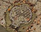 See J3574 : "BCG" access cover, Belfast (1). Another version, on the Belmont - via Daymix