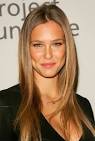 A naked Bar Refaeli rolls