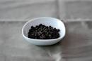 Measuring freshly ground black pepper | Cookthink
