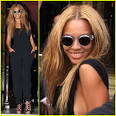 Beyonce smiles while leaving