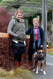 Vine fence: Marketing co-ordinator Sarah McDermid, left, Jane Hunter and Millie at a new “living fence” created to delineate the cellar door space from the ... - 7451832
