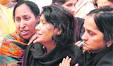 Sarla Gupta (centre), widow of