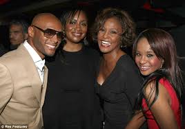 Laughing on her last night: Kenny Lattimore, sister-in-law Patricia Houston, Whitney and daughter Bobbi Kristina posed at Kelly\u0026#39;s event - article-2100266-11B1BB91000005DC-741_634x444