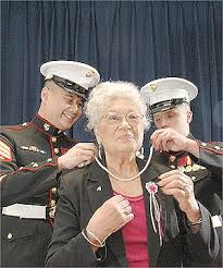 OLA THORSEN/Dominion Post. HANDSOME GIFT: US Marine sergeants Pnillop Damrongtham and Michael Clear present Joan Cllos with pearls. - 72222