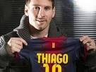 Leo Messi hold's up a shirt that could probably fit him too. - messi-camiseta-thiago-11112