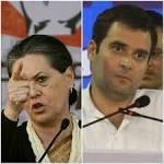 Posters criticising Sonia Gandhi, Rahul Gandhi appear in.