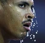 Felix Sanchez of the Dominican Republic pours water on his head after ... - bs27