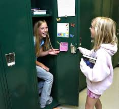 Friends Meeting School seventh-graders Tori Willis (left) and Izzy Peterson, both 12, play around with their new lockers at the Ijamsville school. - friends_nu0917aw_rgbb