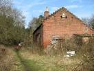 The old slaughterhouse. The brick building beside the public footpath to - via Daymix