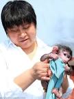 Kind: Zoo keeper Wang Yuping