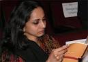 Meanwhile Aruna Anand studies the tournament brochure. - aruna01