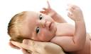 A newborn baby boy looking at