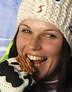 APAustria's Anna Fenninger bites her gold medal she won in the women's ... - 9274105-large