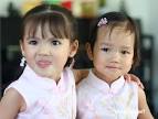 Zaria and Tasha in similar cheong sum. Everybody looks so happy to be 'twins