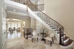 Foyer With Curved Staircase In Luxury Home Royalty Free Stock ...