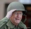 WWII veteran Sgt. Ray Schumacher from Anapolis, Md., salutes as he walks in ... - vet-parade-1111jpg-c8ad5018daf6f019_large