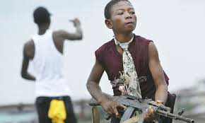 Steven Powles | The Guardian - Liberian-child-soldier-008