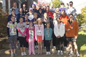 Homecoming 5K Winners-First row, l-r: Desiree Dye, Anna Evert, Lauren Knicl, Marizona Dahlstrom,Tiffany Slater, Nevy White, and John Simmons. - funrun2