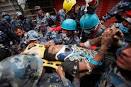 Rescuers pull out survivor as Nepal capital remains on.