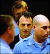 Fatmir Limaj was brought to The Hague in early 2003 - _41075978_limaj_ap203b