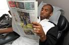 Kobe Bryant holds USA Today newspaper.