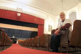 Marty Lindvahl, director of choral music, sits in the auditorium at Danville High School Friday. The Danville school board will consider naming the ... - 20101210-200107-pic-217820472